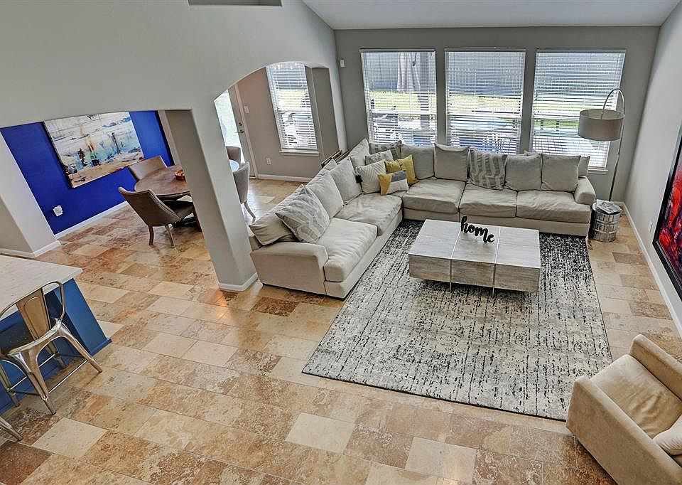 View of the open kitchen, breakfast nook and family den from second level.