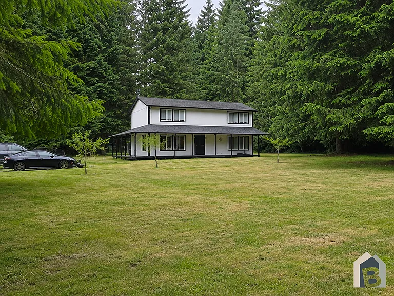 Nestled on a sunny 1.25 beautiful acres with mature evergreens