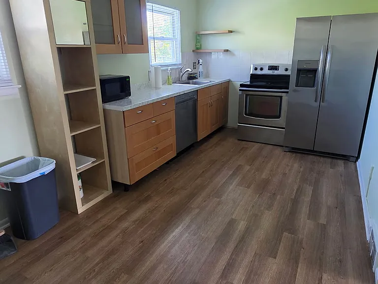 The kitchen is floor has been renovated; the countertop has been changed, and the walls are freshly painted.