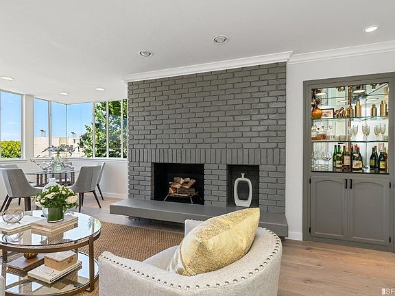 Upper level living room: fireplace and dry bar.