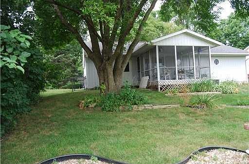 Rear yard, screen porch.