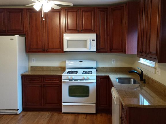 Kitchen with cherry cabinets and granite counters
