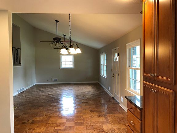 Great room, new ceiling fans, parquet flooring.