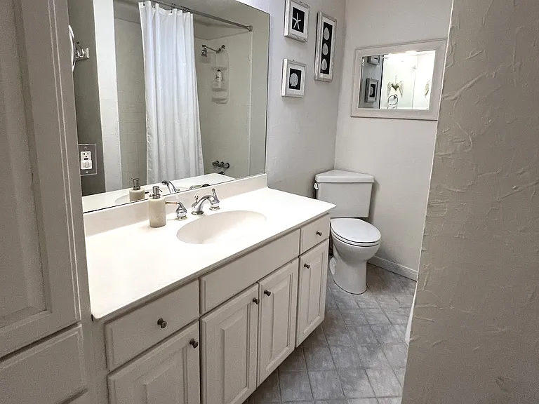 Enjoy hot showers, soaking tub. Bathroom features adjustable height showerhead, drawer storage, linen storage and clothes hamper