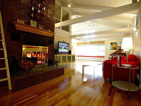Living room with 1 of the 2 fireplaces