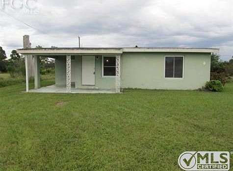 House is a concrete block with double pane windows.