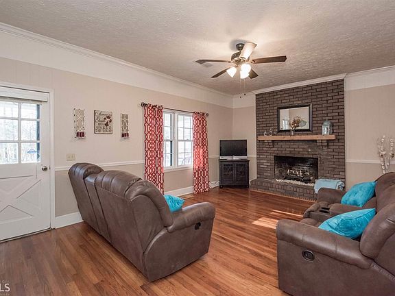 original hardwood floors, gas logs , Fireplace can easly be converted to wood burning.