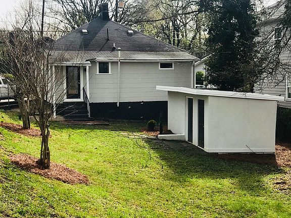 Large fenced yard with storage shed