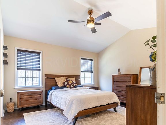 Master Bedroom with vaulted ceilings and two closets.