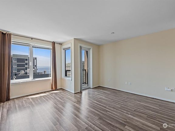 Sun-filled room with hardwood floor