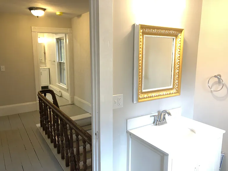 Powder bath down the hall from second full bath.