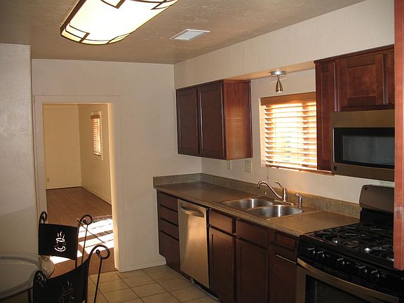 Large remodeled kitchen, newer counters, wood cabinets, built in microwave and gas range/oven.