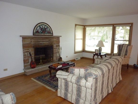 Spacious, sun drenched living room with picture window