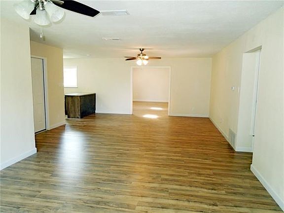 Living dining area looking from front door towards bonus room on the back. Lots of space here!