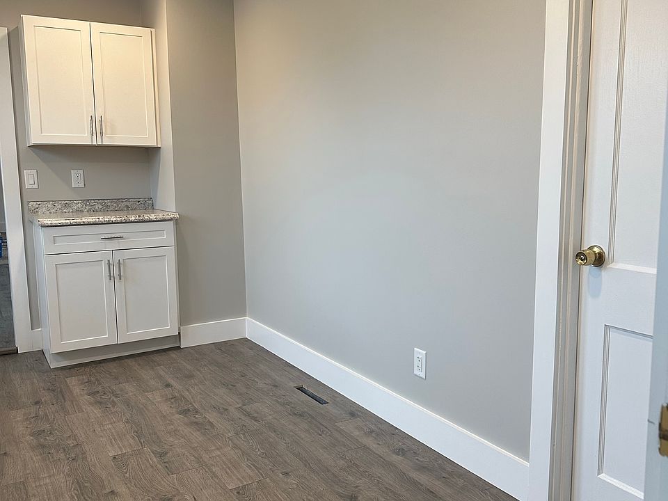 Laminate flooring in kitchen, dining and bathroom. Extra wall space in kitchen for movable island or small desk.
