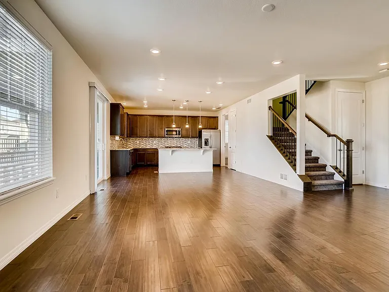 Long view toward gourmet kitchen and stairway.