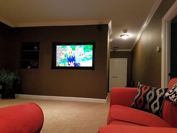 Den showing large screen TV with Satellite