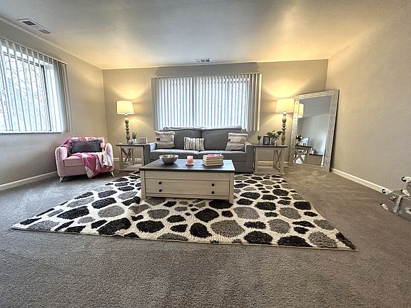Living Room 
Large windows - New carpeting