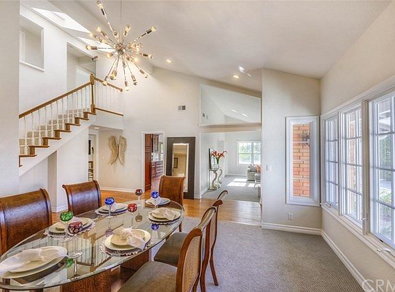 Formal Dining Room W/ Vaulted Ceilings and Plenty Of Natural Light