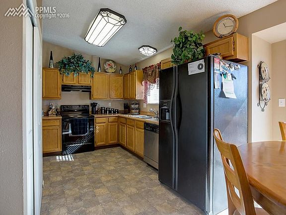 Kitchen with plenty of storage cabinets and eat-in area