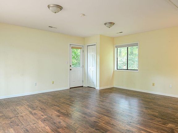 View of the backdoor with closet. Open space here big enough to fit a queen bed, couch and media center, and dining nook set.