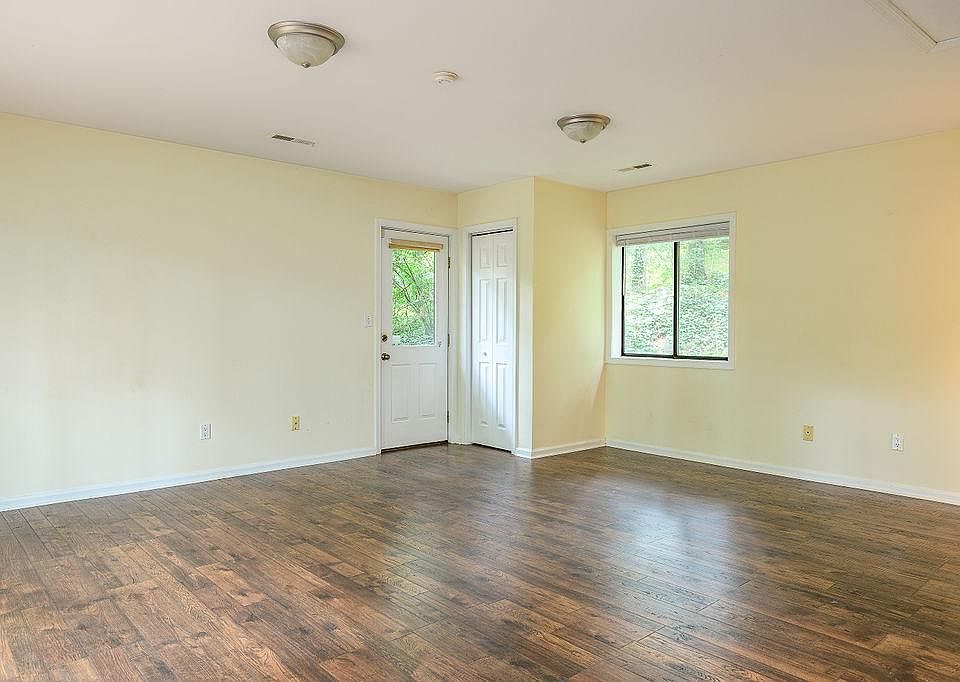 View of the backdoor with closet. Open space here big enough to fit a queen bed, couch and media center, and dining nook set.