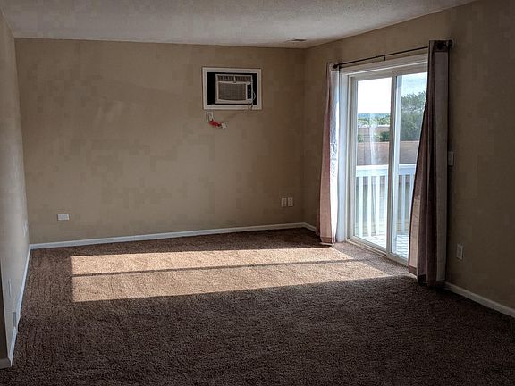 Entrance View into Living Room and Dining Room 