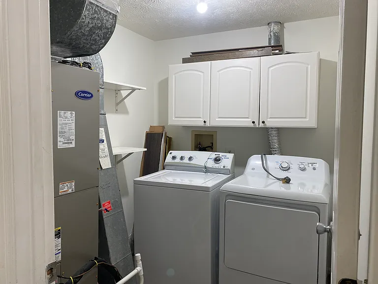 Laundry/utility closet on second level