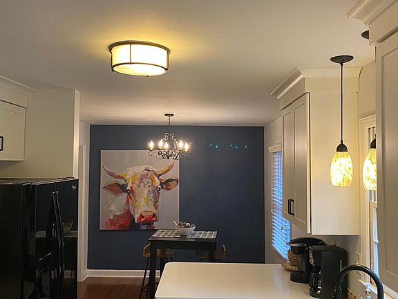 kitchen space going into eat in kitchen area. (Bistro table)