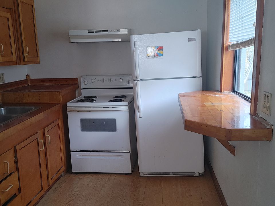 View of kitchen with custom woodwork.