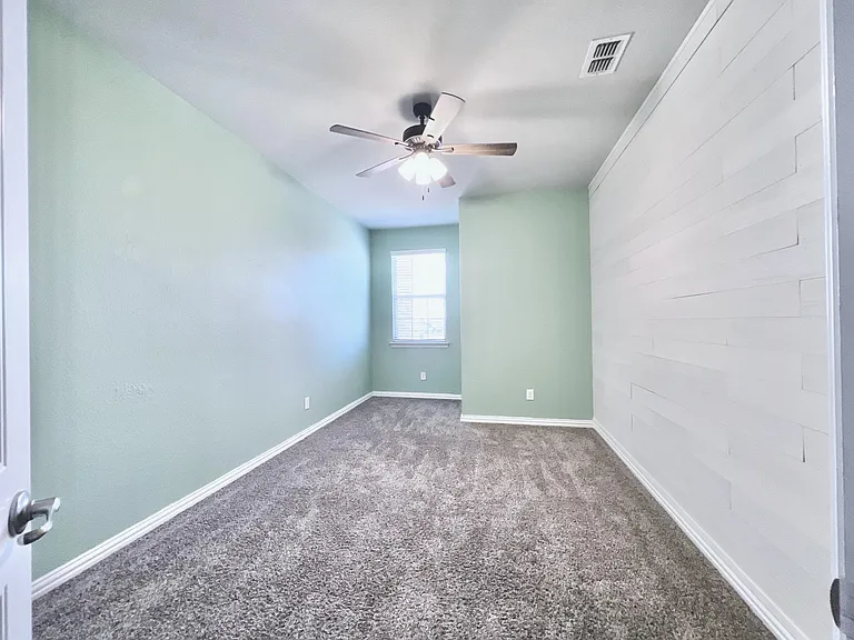 Bedroom #4 upstairs with accent wall and custom colors