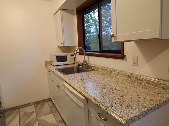 New countertops, cabinets, and sink