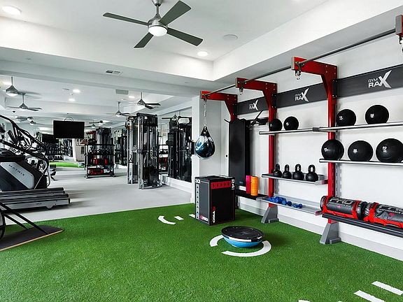 Fully Equipped Gym with Cardio Equipment and Functional Training Area