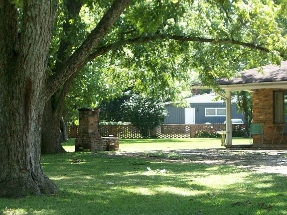 View of the backyard & brick grill