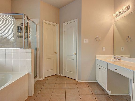 Well-Lit White Master Bath