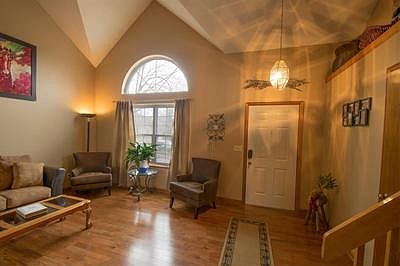 View of the front room / living room from the base of the stairs