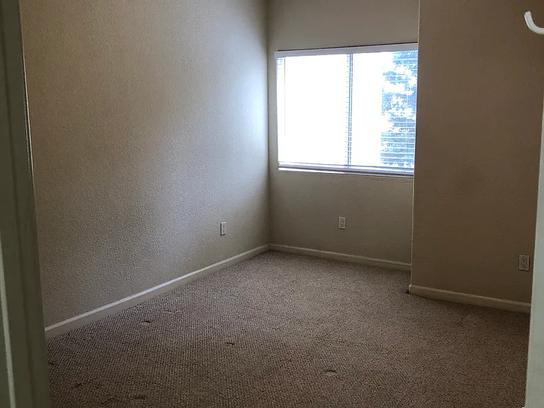 Master bedroom has a nook for desk. Window overlooks Dog park area.