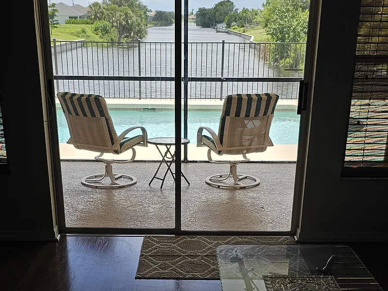 Living Room view to canal, pool & lani