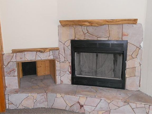 Wood burning fireplace w/built in log storage