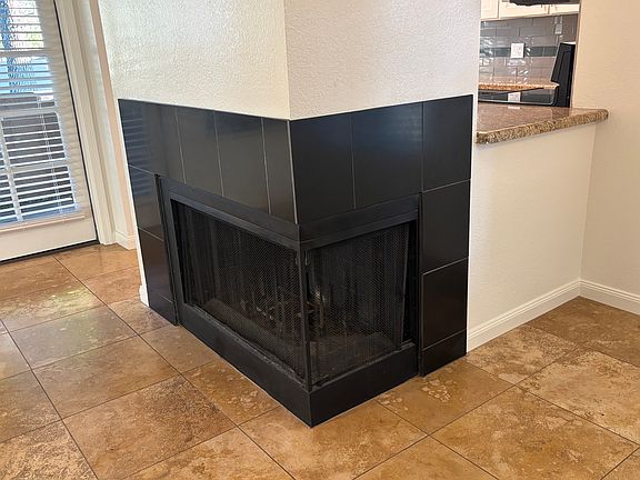 Cozy wood fireplace.