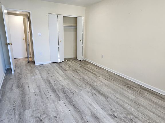 Large Bedroom with double closet. Can fit King furniture.
