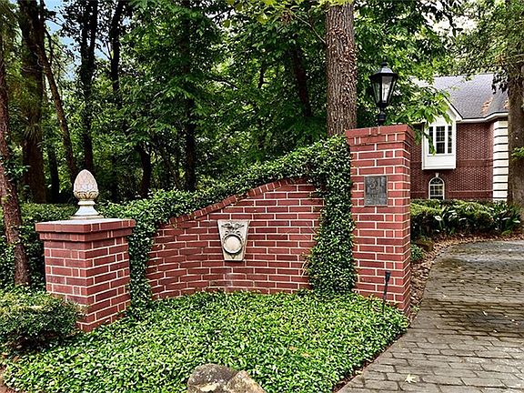 This is the entry to the left side of the circle driveway with address marker.