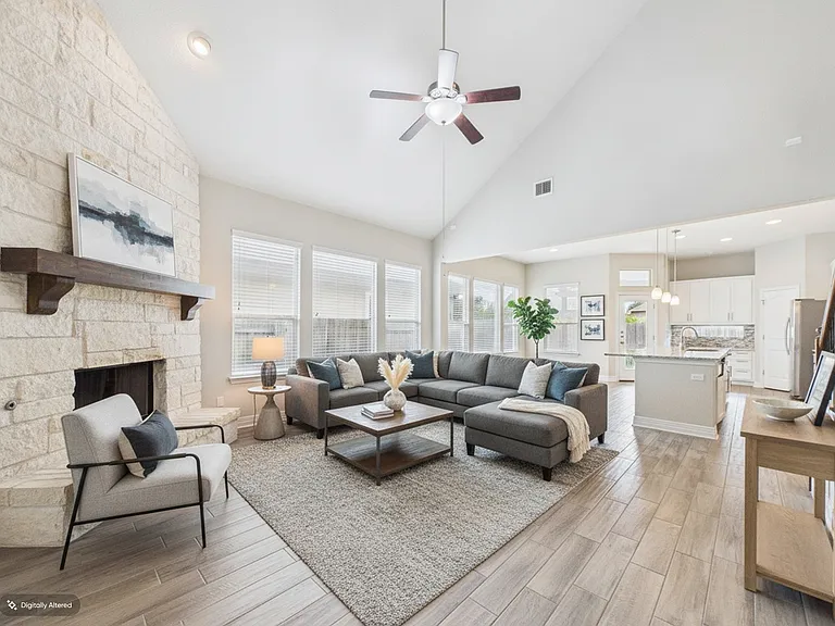 Living Room complete with Fireplace and Texas limestone