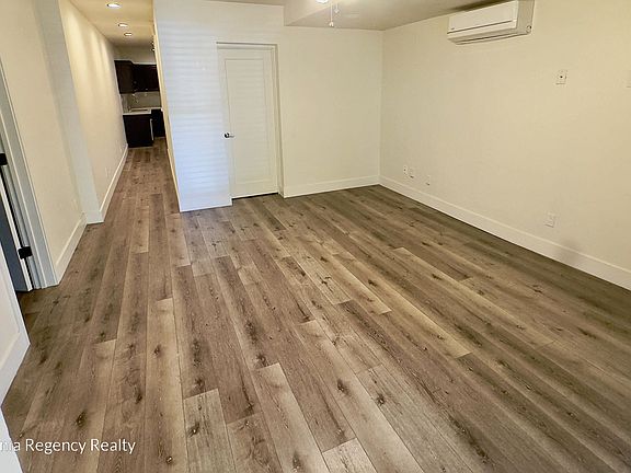 Spacious living area with updated finishes and flooring.