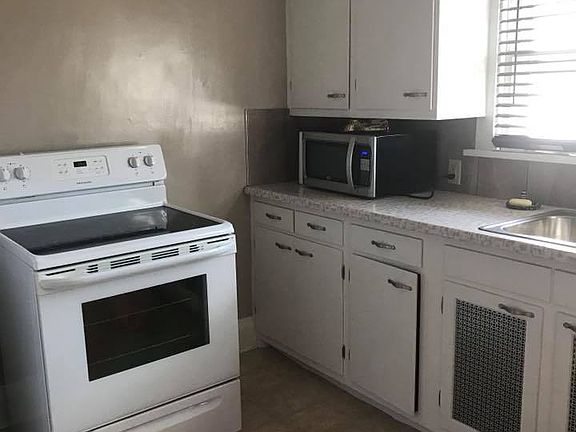 Kitchen cabinets, microwave & stove