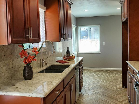 Brand new kitchen - cabinetry- granite counter tops- all new stainless steel appliances and sink-nook area fits table for four- door provides access to the garage