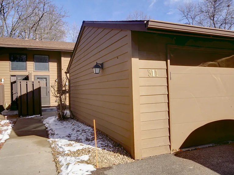 Includes a one car garage stall with opener and additional two parking spots in front of the garage.