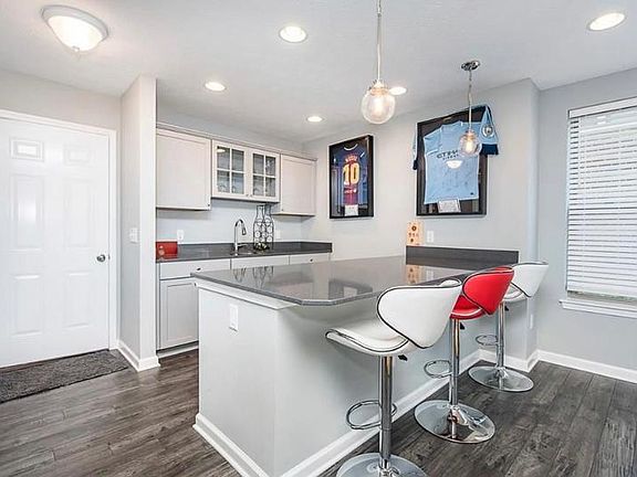 Lower Level wet bar with under counter fridge.