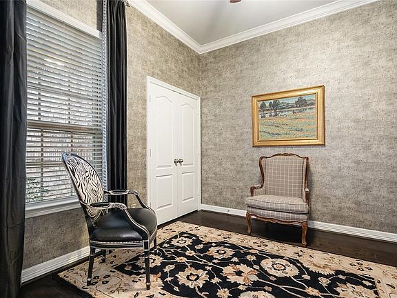 Generous Study with Closet, Crown Moulding, Wood Floors, and French Doors