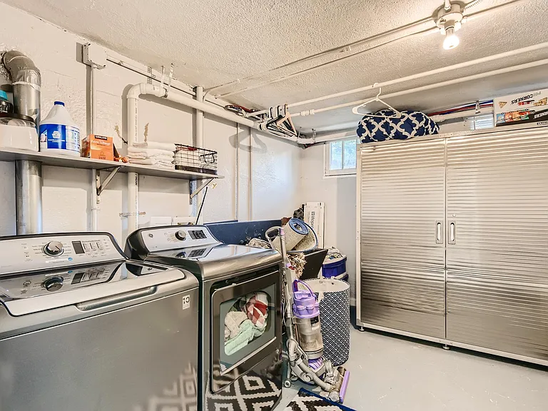 Laundry room with plenty of storage.